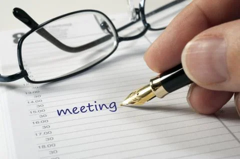 Zeitplaner mit Meeting Stock Photos