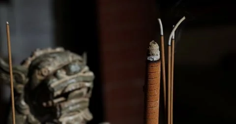 The Zen-like atmosphere of incense in the temple Stock Footage 329874181