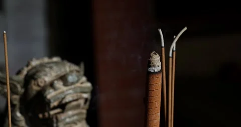 The Zen-like atmosphere of incense in the temple Stock Footage 329874363
