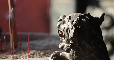 The Zen-like atmosphere of incense in the temple Stock Footage 329874399