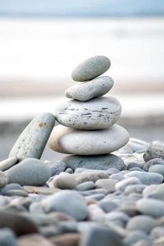 Zen balanced stones stack on beach. Stock Photos