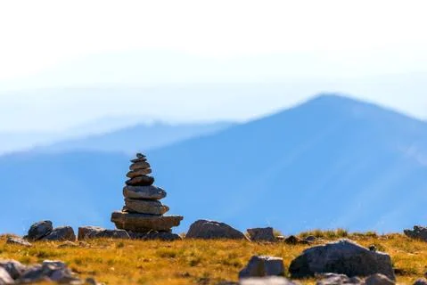 Zen balanced stones stack in high mountains. Scenic mountain view. Stock Photos