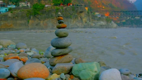 The Zen of Balancing rocks in side of ganges river for best wishes Stock Footage 279801451