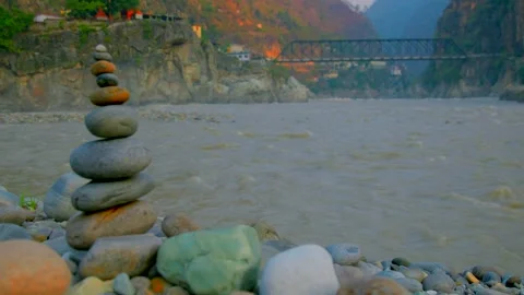 Zen Balancing stones in side of ganges river Stock Footage 279801526
