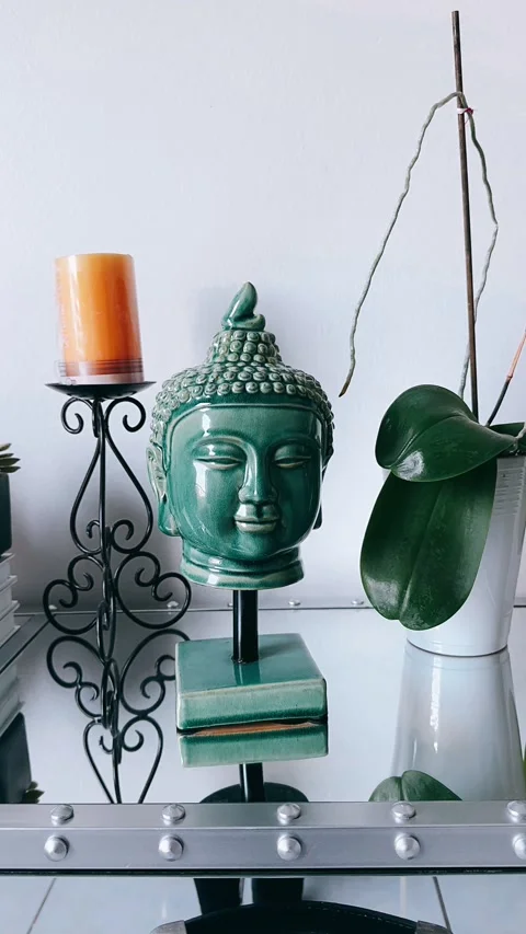 Zen Buddha Statue on a Chic Table with Beautiful Decor Stock Footage 295664174