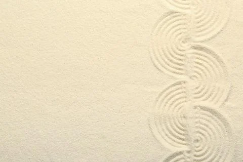 Zen rock garden. Wave pattern on beige sand, top view 스톡 사진