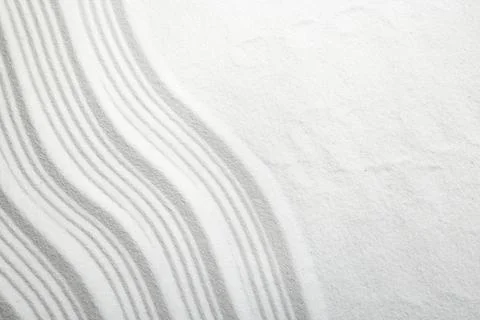 Zen rock garden. Wave pattern on white sand, top view 스톡 사진