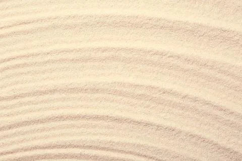 Zen rock garden. Wave pattern on beige sand, top view Foto stock