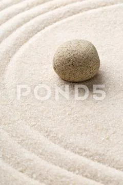 Zen sand and stone garden with raked curved lines. Simplicity, concentration Stock Photos