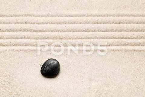 Zen sand and stone garden with raked lines. Simplicity, concentration or calm Stock Photos