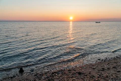 Zen stack of rocks in the sea at sunset Stock Photos