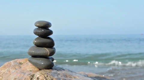 Zen stones on a beach Stock Footage