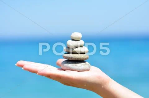 Zen stones hand Stock Photos