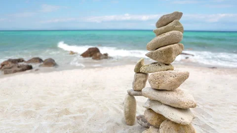 Zen stones stack balanced on exotic beach Stock Footage 245949070
