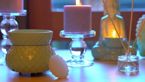 Zen style aromatherapy spa table setting with buddha and burning candles. Stock Footage 129204322