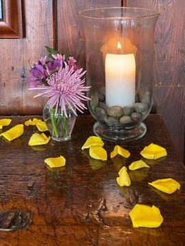 Zen table layout of candle and flowers for calming atmosphere 写真素材