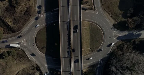 Zenital shot of a roundabout under a highway Stock Footage 85610053