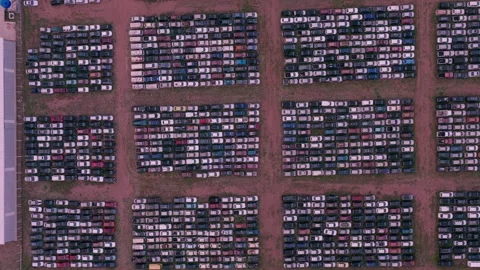 Zenithal Pan Right Across Organized Rows of Stored Vehicles Stock Footage 344202844