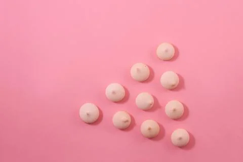 Zephyr biscuits on a light pink background. Stock Photos