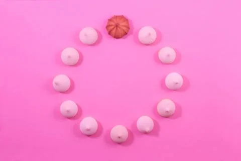 Zephyr biscuits on a light pink-red background. Stock Photos