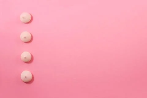 Zephyr biscuits on a light pink-red background. Stock Photos