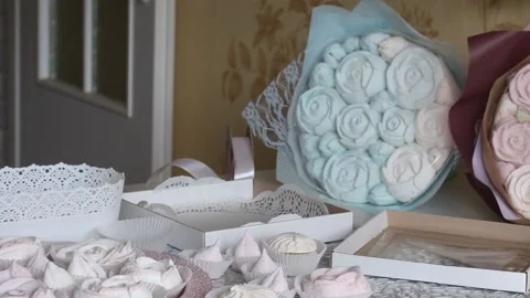 Zephyr bouquets in craft packaging. Consist of marshmallow roses and tulips.  Stock Footage 159348702