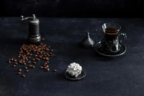Zephyr on a dark background in a plate in the background - a cup of coffee. Stock Photos