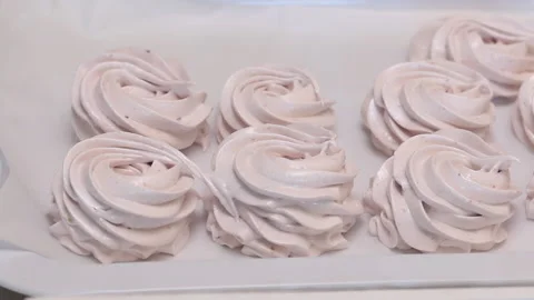 Zephyr on a tray lined with stabilization. Cooking marshmallows. Close-up sho Stock Footage 163651375