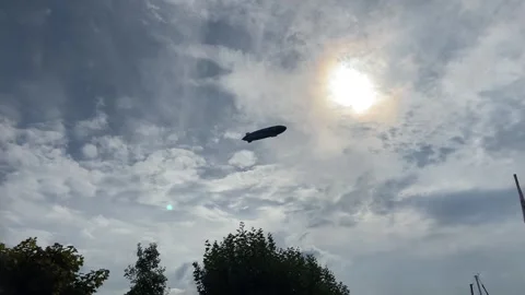 Zeppelin Airship Low Angle Shot Sunny and Cloudy Lake Constance Germany Stock Footage 317911375