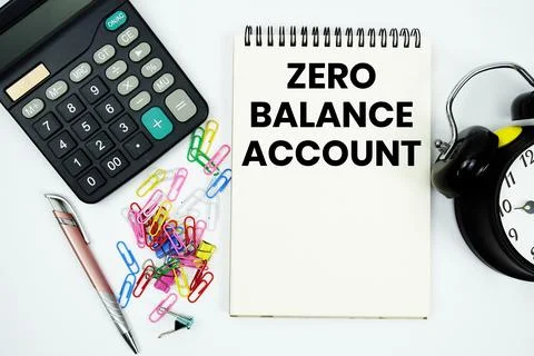 Zero Balance Account text written on notepad with calculator and alarm clock Stock Photos