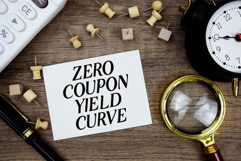 Zero Coupon Yield Curve text written on notepad with pen, alarm clock, magn.. Stock Photos