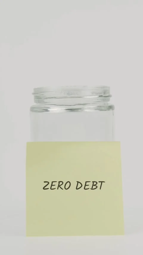 Zero debt text or word on yellow sticky note attached to glass jar with hand Stock Footage 311808362