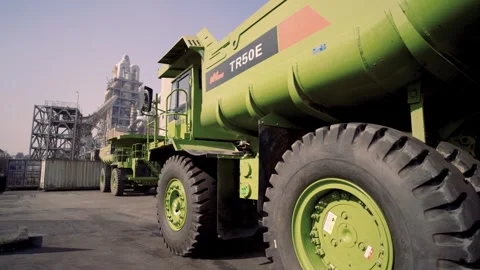 Zero-emission mining: An NHL TR50E EV haul truck transporting minerals across a Stock Footage 333681549