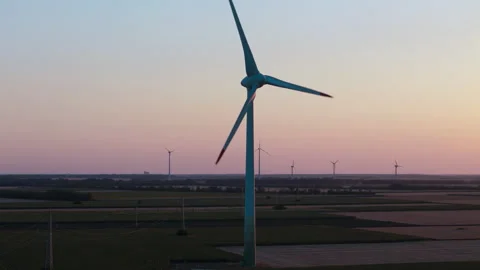 Zero emission renewable energy Sunset wind turbine providing sustainable energy Stock Footage 280138291