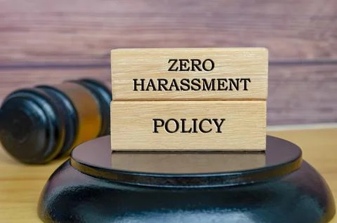 Zero Harassment Policy text written on wooden blocks with gavel background... Stock Photos