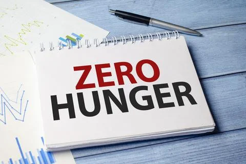 Zero hunger symbol on notepad and wooden background Fotos de archivo