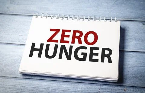 Zero hunger symbol on notepad and wooden background Fotos de archivo