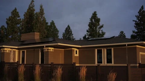 ZERO NET ENERGY HOME AT DUSK – PAN DOWN Stock Footage 52551098