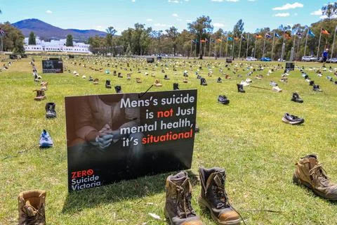 Zero Suicide Awareness Program display featuring boots laid out on the ground Stock Photos
