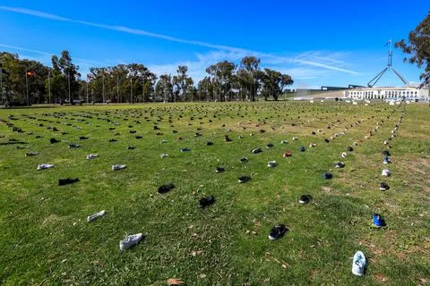 Zero Suicide Awareness Program display featuring boots laid out on the ground Stock Photos
