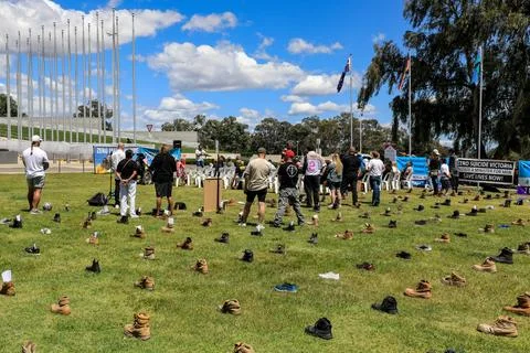 Zero Suicide Awareness Program display featuring boots laid out on the ground Stock Photos