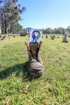 Zero Suicide Awareness Program display featuring boots laid out on the ground Stock Photos