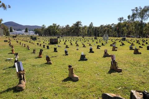 Zero Suicide Awareness Program display featuring boots laid out on the ground Stock Photos