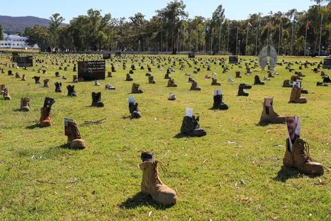Zero Suicide Awareness Program display featuring boots laid out on the ground Stock Photos