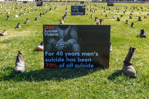 Zero Suicide Awareness Program display featuring boots laid out on the ground Stock Photos
