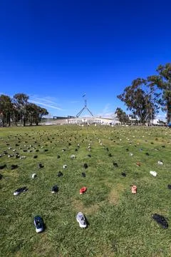 Zero Suicide Awareness Program display featuring boots laid out on the ground Stock Photos