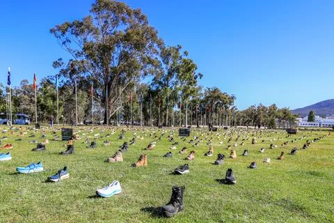 Zero Suicide Awareness Program display featuring boots laid out on the ground Stock Photos