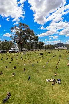 Zero Suicide Awareness Program display featuring boots laid out on the ground Stock Photos