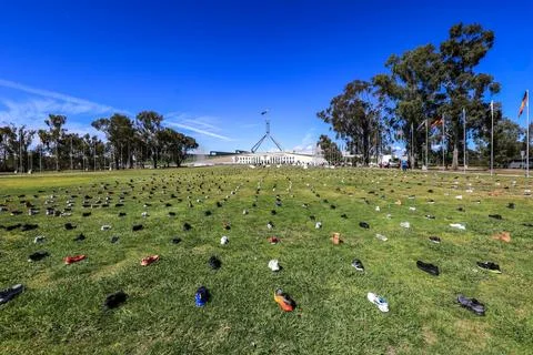 Zero Suicide Awareness Program display featuring boots laid out on the ground Stock Photos