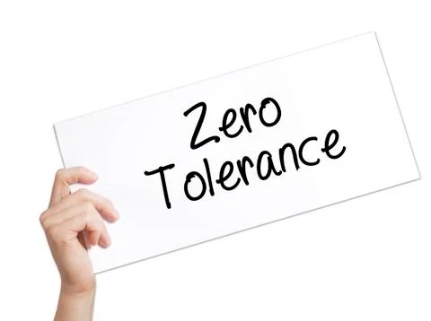 Zero Tolerance Sign on white paper. Man Hand Holding Paper with text. Isolate Foto stock